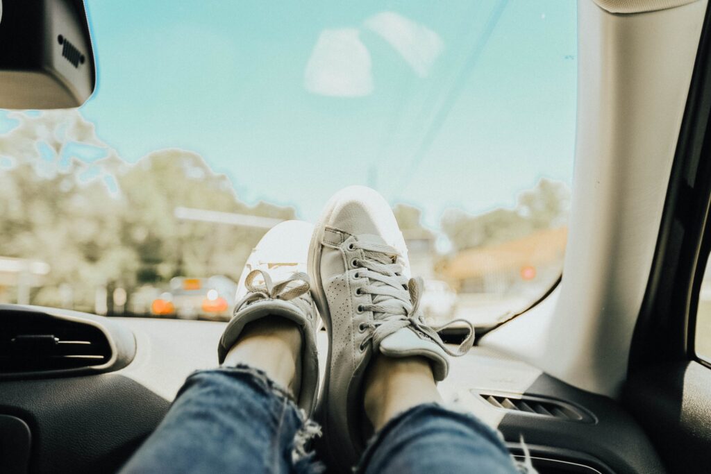 road trip with shoes on the dash