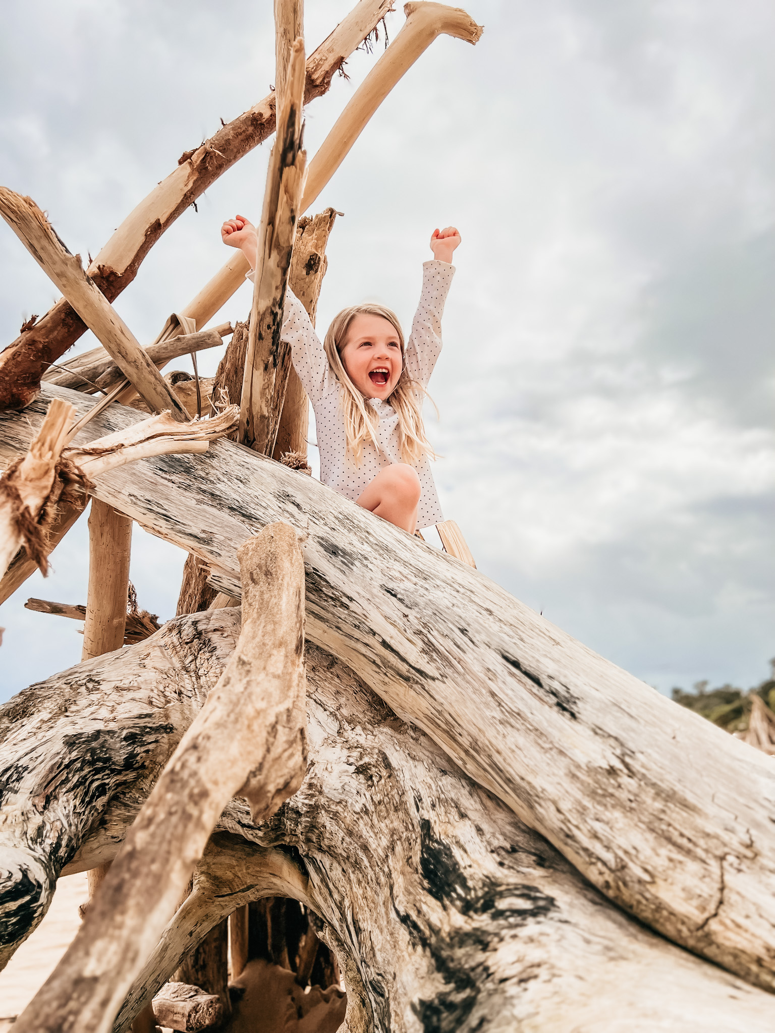 little girl playing at lydgate beach