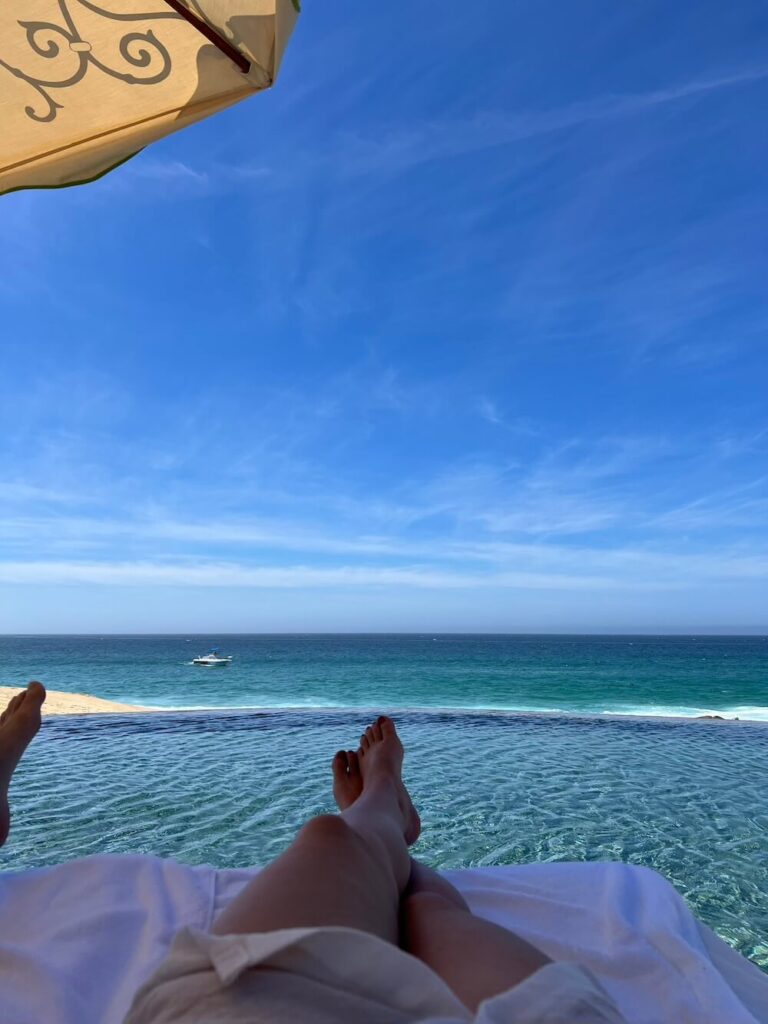 woman's feet on the beach