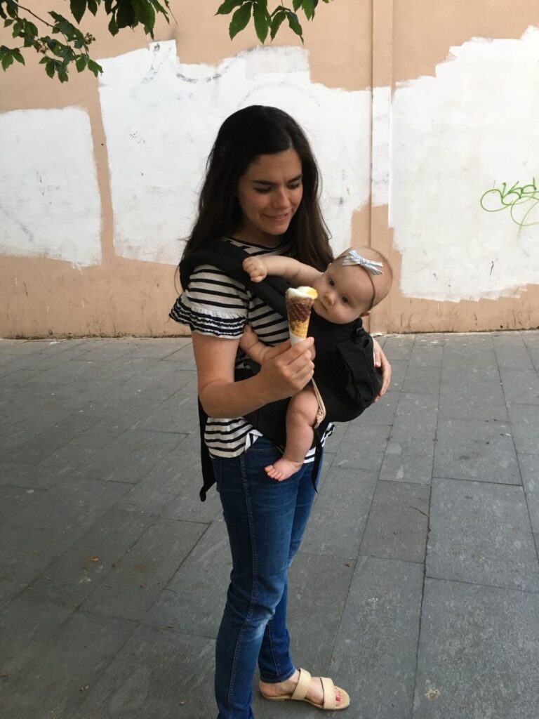 mom carrying baby in Ergo Baby Carrier in Italy